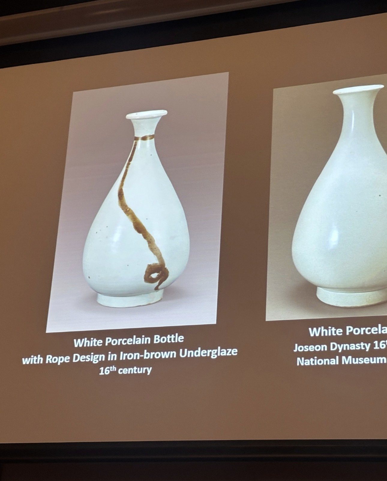 White porcelain bottle with rope design, projected at Cambridge